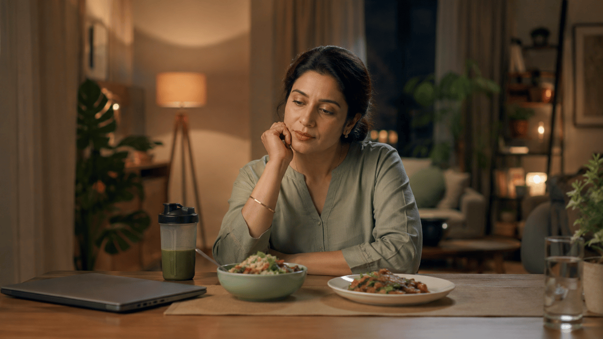 Working woman sitting at dining table after a long day
